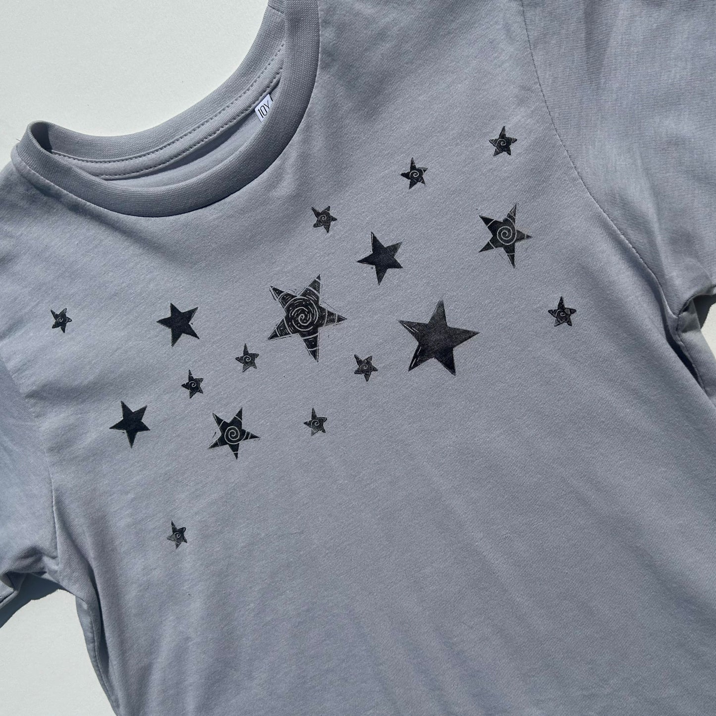 cosmic dust baby tee