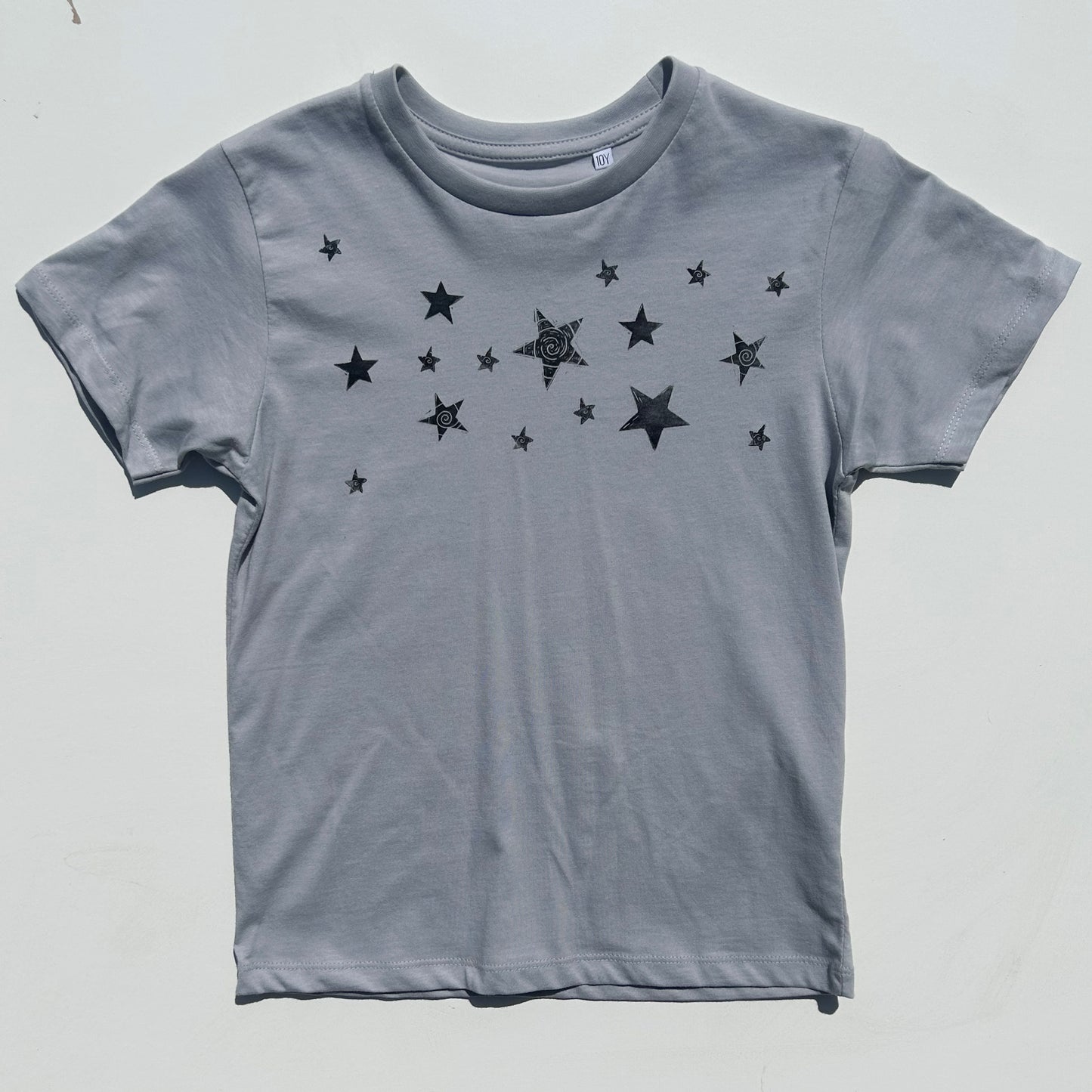 cosmic dust baby tee