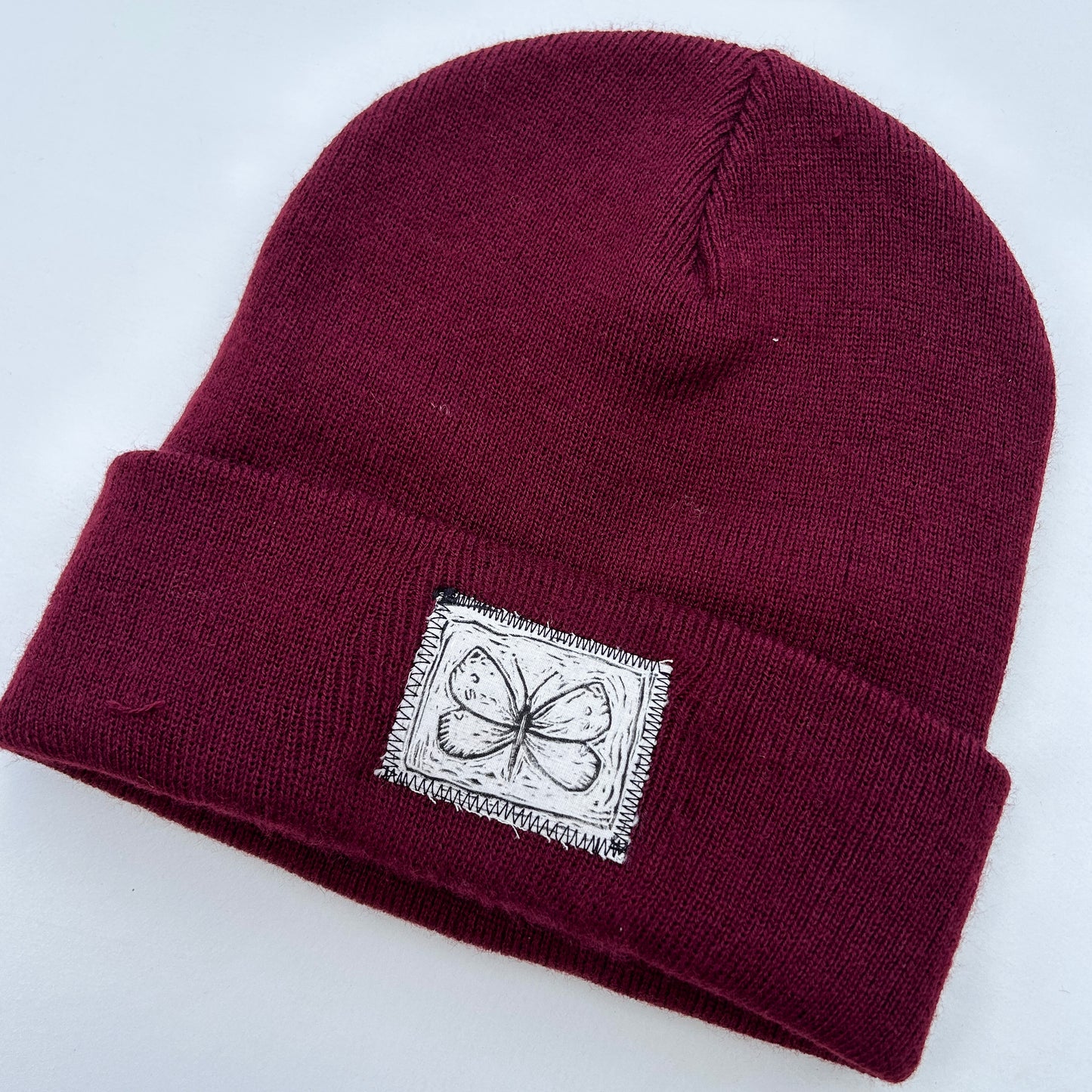 moth maroon beanie